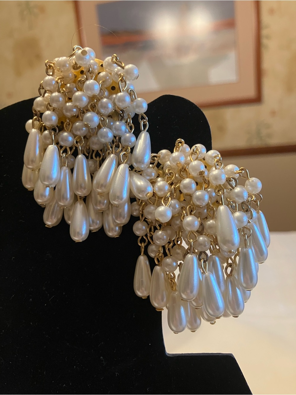 Chandelier earrings featuring faux pearls in a teardrop design clips